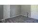 Neutral bedroom featuring gray walls, carpet, and two doors at 626 Tulip Poplar Ct, Mooresville, IN 46158