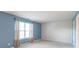 A bright bedroom is illuminated by a large window and features a neutral carpet at 626 Tulip Poplar Ct, Mooresville, IN 46158