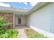 The front porch is brick and siding with a storm door at 626 Tulip Poplar Ct, Mooresville, IN 46158