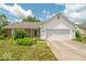 Charming single-story home with a two-car garage and well-manicured lawn and landscaping at 626 Tulip Poplar Ct, Mooresville, IN 46158