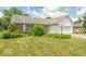 A charming single-story home with a lawn and a two-car garage at 626 Tulip Poplar Ct, Mooresville, IN 46158
