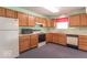 Functional kitchen with appliances and oak cabinets, providing ample storage space at 626 Tulip Poplar Ct, Mooresville, IN 46158