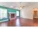 Bright living room with wood floors and a brick fireplace at 626 Tulip Poplar Ct, Mooresville, IN 46158
