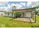 Outdoor patio with pergola, slider door access, and a spacious yard perfect for entertainment at 626 Tulip Poplar Ct, Mooresville, IN 46158
