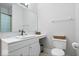Clean bathroom with white cabinets, sleek fixtures, a modern vessel sink, and ample counter space at 6528 Fountain Springs Blvd, Indianapolis, IN 46236