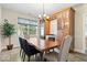 Elegant dining room with a live-edge table, stylish chandelier, and custom cabinets at 6528 Fountain Springs Blvd, Indianapolis, IN 46236