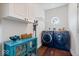 Well-organized laundry room with modern washer and dryer and custom cabinetry at 6528 Fountain Springs Blvd, Indianapolis, IN 46236