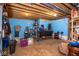 Unfinished basement with blue walls, concrete floor, and exposed ceiling at 6532 Amherst Way, Zionsville, IN 46077