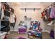 Organized walk-in closet with ample shelving and an accent chair, providing a functional space at 6532 Amherst Way, Zionsville, IN 46077