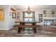 Beautiful dining room featuring a chandelier, a table with bench seating and lots of storage at 6532 Amherst Way, Zionsville, IN 46077
