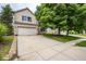 Exterior view of a suburban home with a large driveway and well-manicured lawn at 6532 Amherst Way, Zionsville, IN 46077