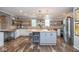 Bright kitchen with butcher block countertops, island with seating, and stainless steel appliances at 6532 Amherst Way, Zionsville, IN 46077