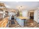 Spacious kitchen featuring wooden countertops, a gray center island, and stainless steel appliances at 6532 Amherst Way, Zionsville, IN 46077