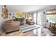 Inviting living room with a fireplace, white built-ins, and access to the backyard through glass doors at 6532 Amherst Way, Zionsville, IN 46077