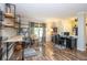 Bright living room with hardwood floors, custom shelving, and a dedicated office space at 6532 Amherst Way, Zionsville, IN 46077
