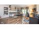 Functional office space with custom shelving, hardwood floors, and a comfortable workspace at 6532 Amherst Way, Zionsville, IN 46077