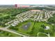 Aerial view of a neighborhood featuring a pond and surrounding green spaces at 6670 Shooting Star Dr, Whitestown, IN 46075