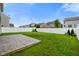 This backyard has a patio that transitions to a lawn and the yard is fully enclosed at 6670 Shooting Star Dr, Whitestown, IN 46075
