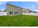 This home features a spacious, grassy backyard enclosed by a white vinyl fence for privacy at 6670 Shooting Star Dr, Whitestown, IN 46075