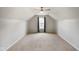 Bedroom showcasing neutral paint, carpet, a ceiling fan, and large window at 6670 Shooting Star Dr, Whitestown, IN 46075