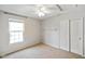 Bedroom featuring neutral paint, carpet, a ceiling fan, and large window at 6670 Shooting Star Dr, Whitestown, IN 46075