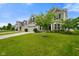 Well-manicured front lawn and landscaping enhance this inviting home's curb appeal at 6670 Shooting Star Dr, Whitestown, IN 46075