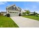 This home features a wide driveway, two-car garage, and well-maintained lawn at 6670 Shooting Star Dr, Whitestown, IN 46075