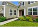 Charming front entrance with a well-maintained lawn and colorful landscaping adding to the curb appeal at 6670 Shooting Star Dr, Whitestown, IN 46075