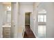 Hallway with convenient mudroom bench leading into the main living space at 6670 Shooting Star Dr, Whitestown, IN 46075