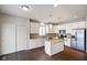 Modern kitchen boasts granite countertops, stainless steel appliances, and center island, perfect for entertaining at 6670 Shooting Star Dr, Whitestown, IN 46075