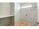 This laundry room features vinyl flooring, upper storage, and washer/dryer hookups at 6670 Shooting Star Dr, Whitestown, IN 46075