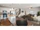Bright and open living space with a kitchen island, modern appliances, and a stylish dining area at 6670 Shooting Star Dr, Whitestown, IN 46075