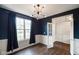Comfortable study area with hardwood flooring, modern light fixture, and a private atmosphere at 6670 Shooting Star Dr, Whitestown, IN 46075