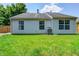 Lush green backyard with well-maintained lawn and mature trees, creating a serene and private outdoor space at 6740 Sundown S Dr, Indianapolis, IN 46254
