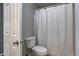 A bathroom with a white toilet and white shower curtain at 6740 Sundown S Dr, Indianapolis, IN 46254