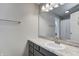 Granite vanity top with cabinets and large mirror in bathroom at 6740 Sundown S Dr, Indianapolis, IN 46254