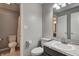 Full bathroom featuring double toilet, granite vanity and shower with curtain at 6740 Sundown S Dr, Indianapolis, IN 46254