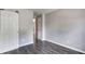 A bedroom with gray walls and wood-look floors leads to other rooms at 6740 Sundown S Dr, Indianapolis, IN 46254