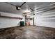 Two car garage with finished walls and ceiling, storage, utility hookups, and two overhead doors at 6740 Sundown S Dr, Indianapolis, IN 46254