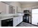 Updated kitchen featuring white cabinets and granite countertops at 6740 Sundown S Dr, Indianapolis, IN 46254