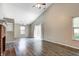 Vaulted ceiling living room featuring wood floors and lots of natural light at 6740 Sundown S Dr, Indianapolis, IN 46254