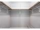 A walk-in closet offers ample storage with installed shelving and rods for organizing clothes at 6740 Sundown S Dr, Indianapolis, IN 46254