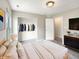 Cozy bedroom featuring neutral colors, a closet, and a comfortable bed with soft pillows at 6933 Sonora Blvd, Clermont, IN 46234
