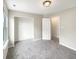 Clean, empty bedroom with a window and closet, ready for personal touches at 6933 Sonora Blvd, Clermont, IN 46234