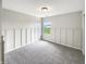 Bright bedroom featuring neutral walls, plush carpeting, and a window at 6933 Sonora Blvd, Clermont, IN 46234