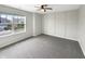 Carpeted bedroom with a ceiling fan and natural light from a window at 6933 Sonora Blvd, Clermont, IN 46234