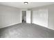 A carpeted bedroom features an open door and closet at 6933 Sonora Blvd, Clermont, IN 46234