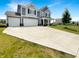 Beautiful two-story home with a three-car garage and a well-maintained front yard at 6933 Sonora Blvd, Clermont, IN 46234
