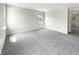 Spacious living room with carpet flooring and a window offering natural light at 6933 Sonora Blvd, Clermont, IN 46234