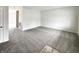 Empty living room with neutral carpet and paint, offering a versatile space for customization at 6933 Sonora Blvd, Clermont, IN 46234